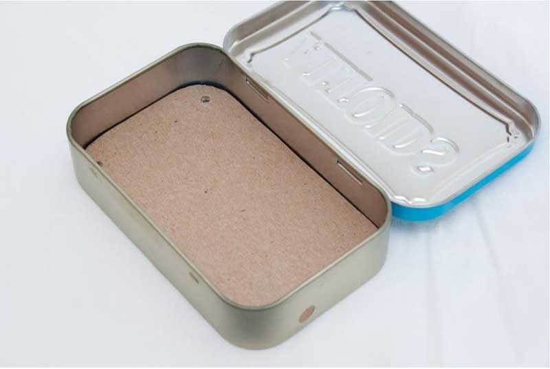 remove cardboard, turn over & put it back in tin