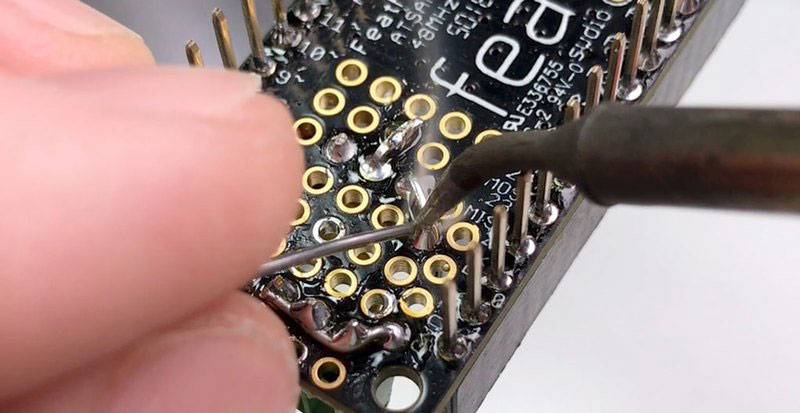 Solder bottom 3 pins to GND/solder top 2 pins together